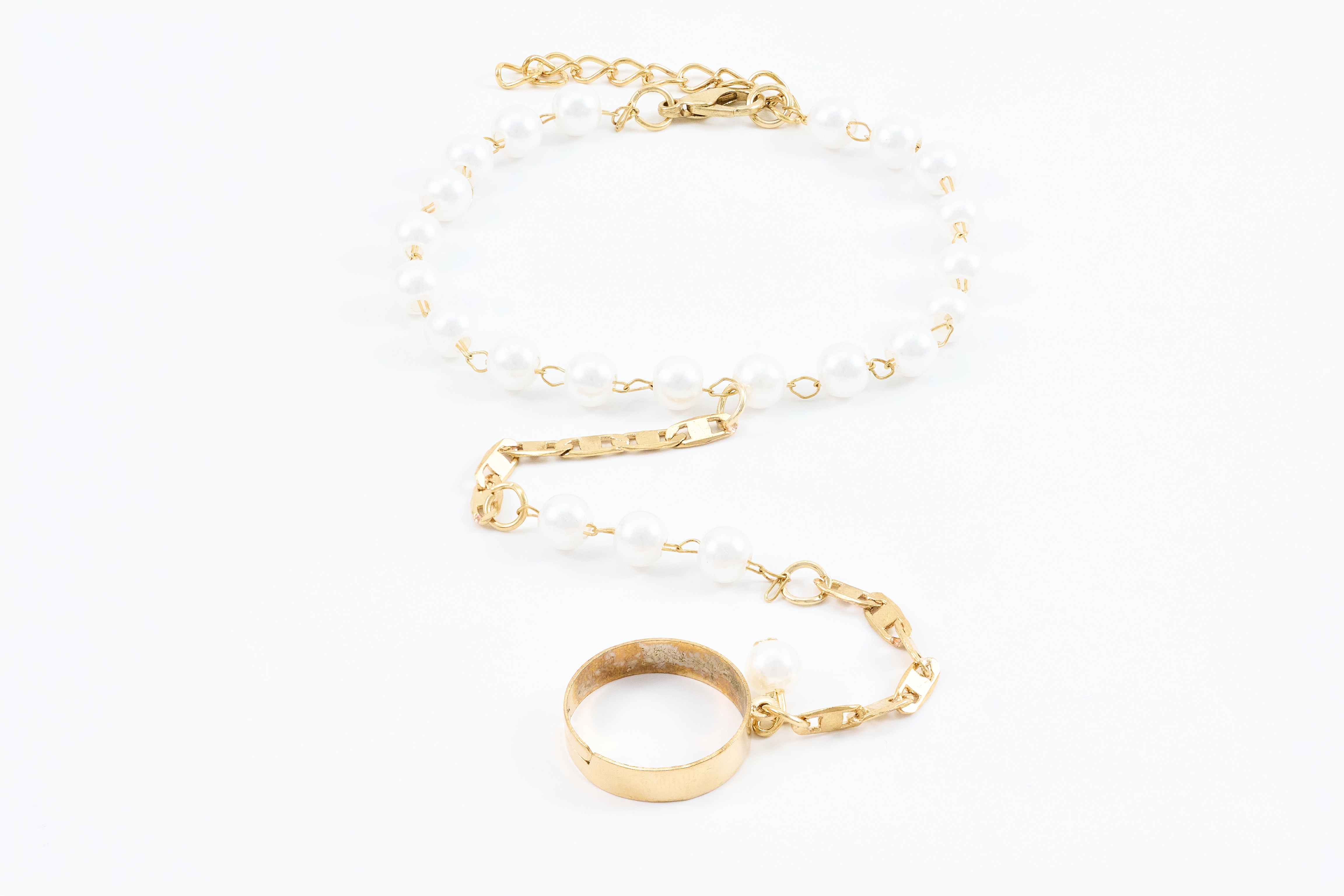 Gouden armbandenset met schakels en bedels