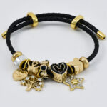 Gouden brede bangle met subtiele gravure