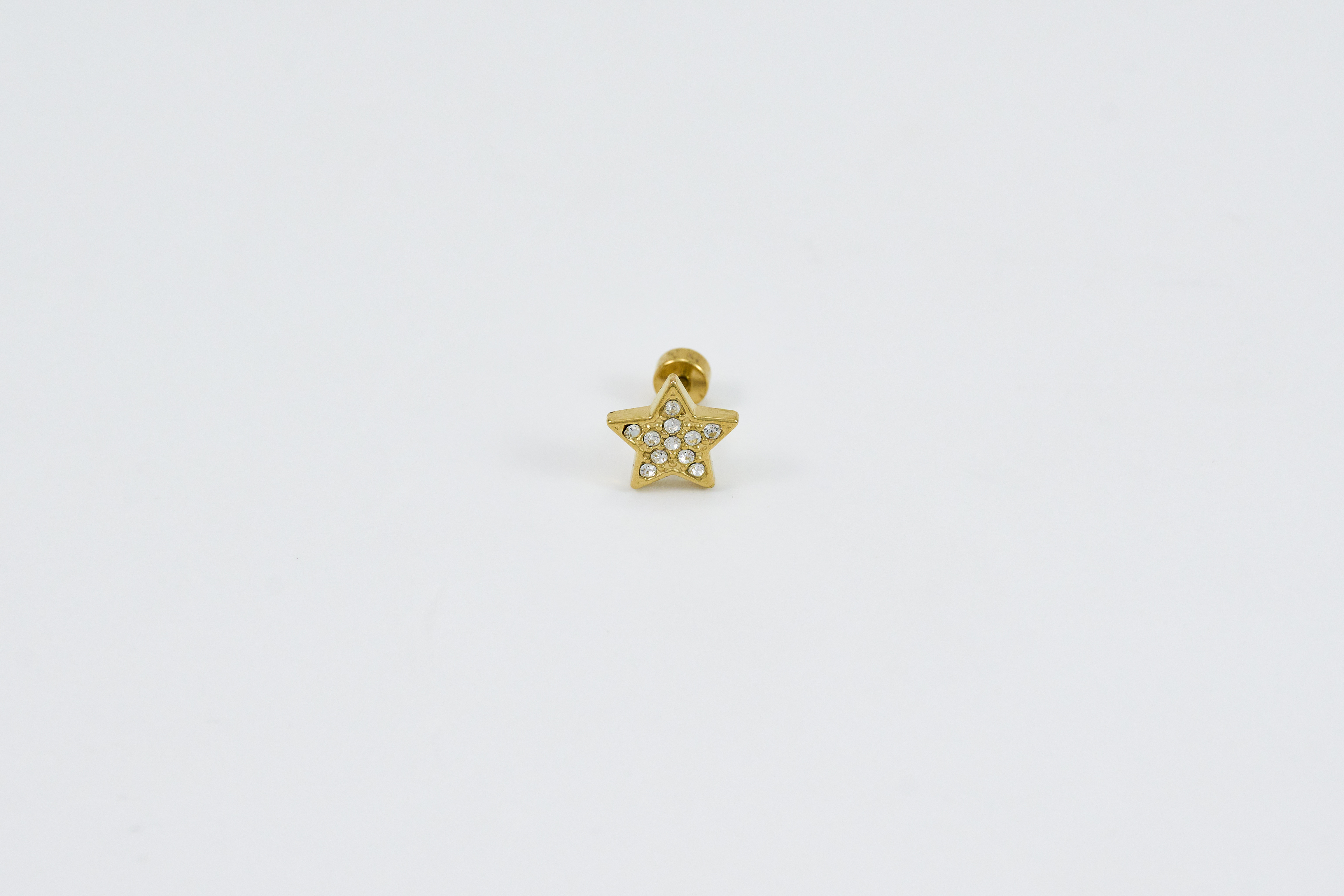 Gouden stervormige piercing met glans