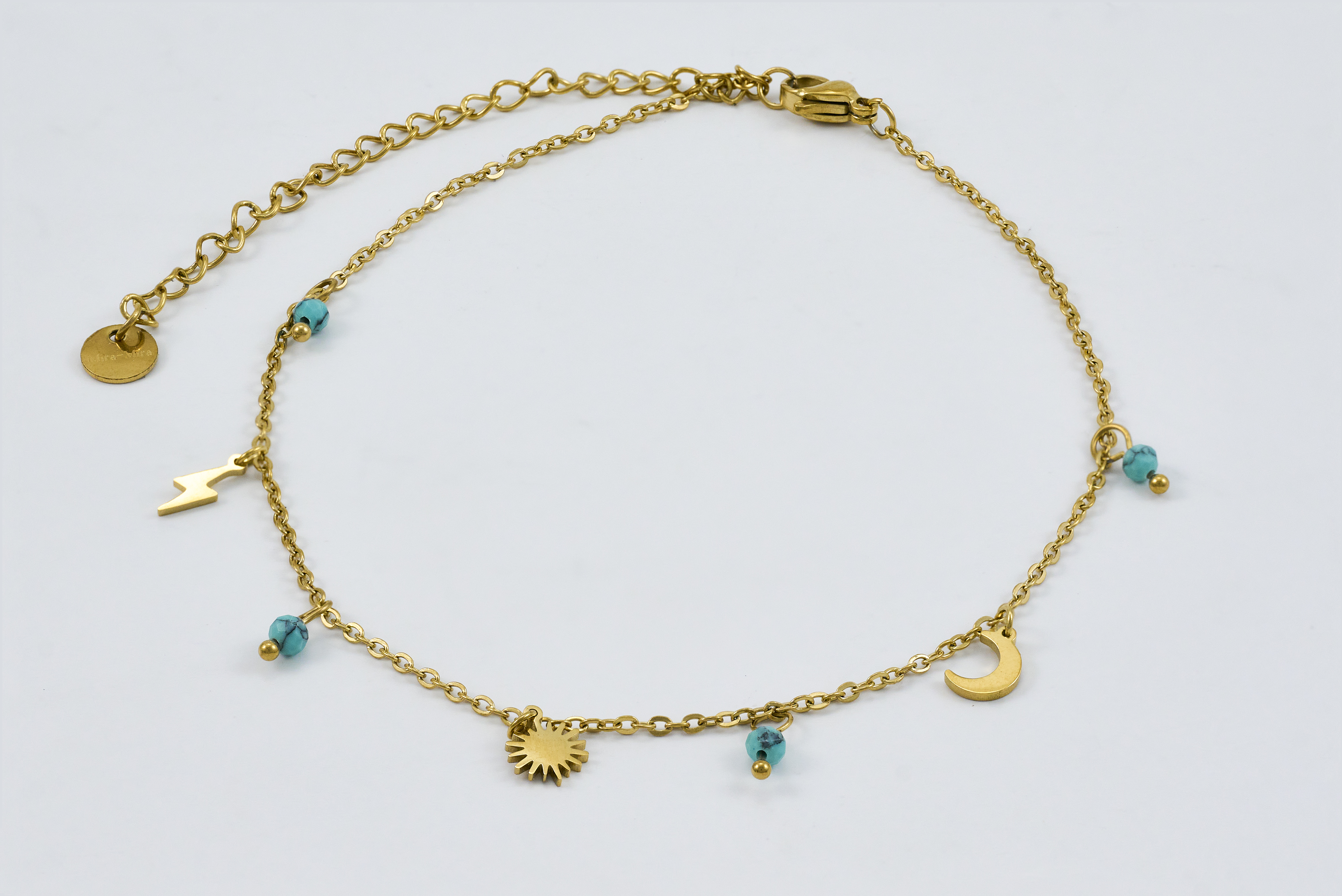 Minimalistische gouden enkelband met turquoise details