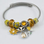 Zilveren armband met oranje en sprankelende steentjes